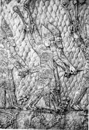 Assyrian warriors hurling stones. The carving is from a wall decoration in the palace of Sennacherib at Nineveh (early seventh century BCE).