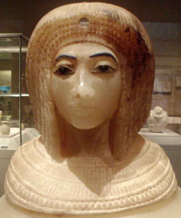 Close-up of an Egyptian alabaster canopic jar depicting a likeness of Amarna-era Queen Kiya wearing a Nubian wig