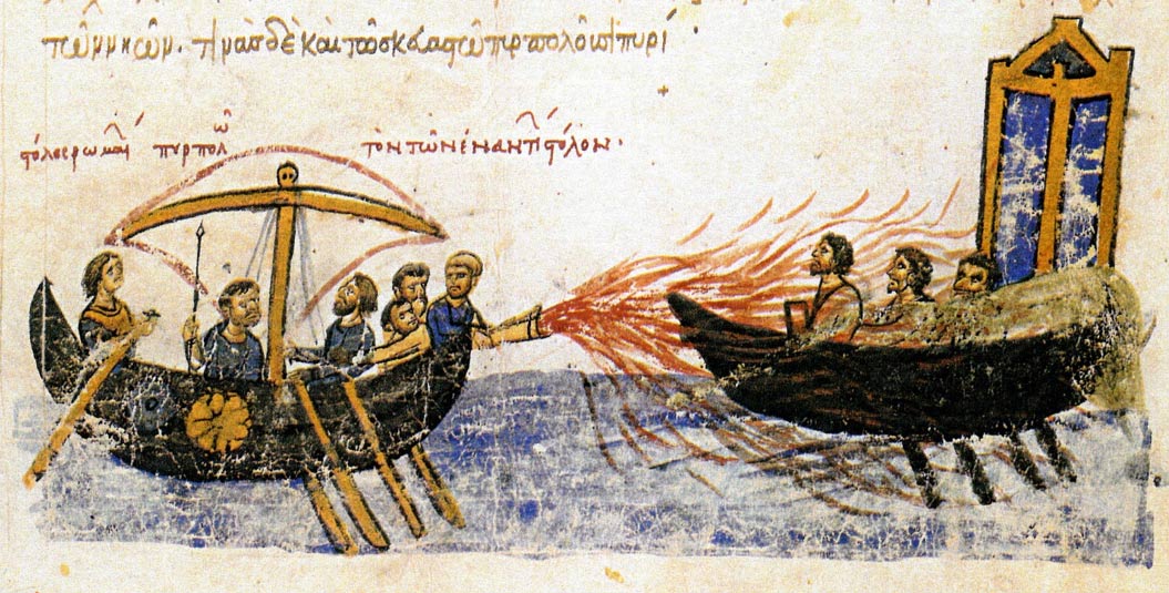 Image from an illuminated manuscript, the Madrid Skylitzes, showing Greek Fire in use against the fleet of the rebel Thomas the Slav. The caption above the left ship reads, “the fleet of the Romans setting ablaze the fleet of the enemies.” 