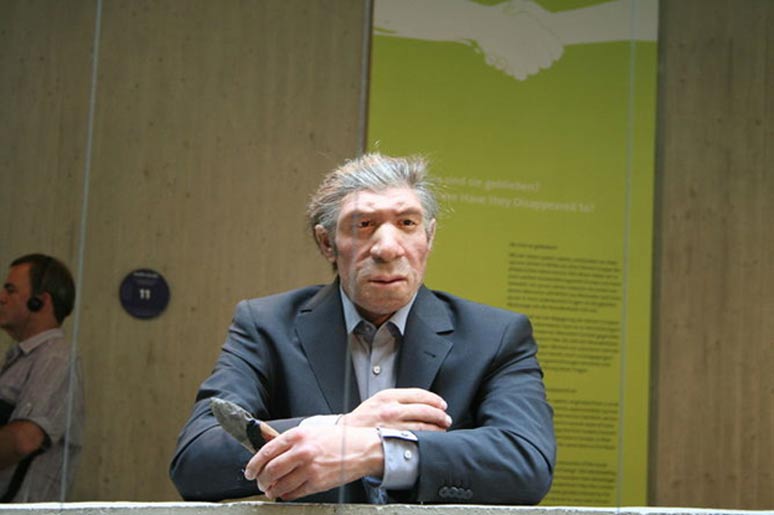Could they pass unnoticed among us? Reconstruction of a Neanderthal man in a modern suit, at the Neanderthal Museum, Krapina, Croatia