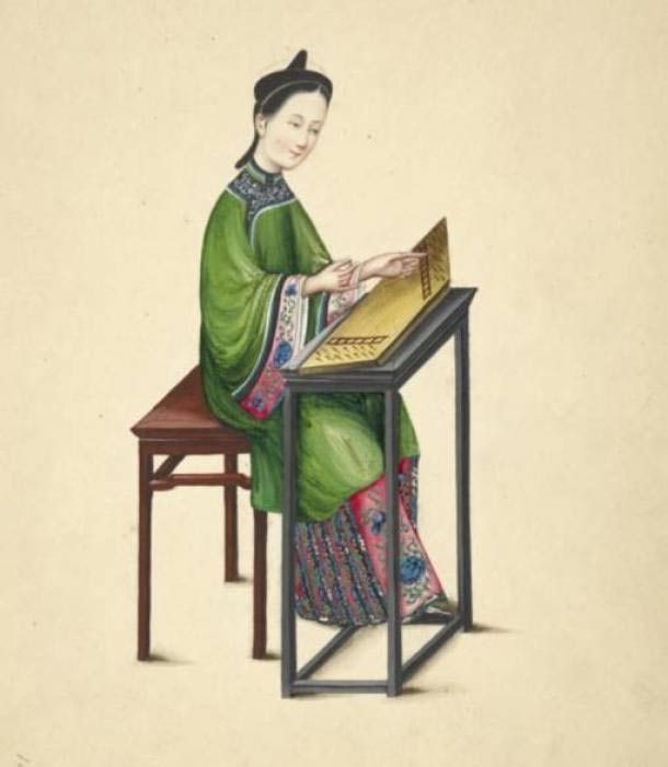 Watercolor illustration of a woman playing a zheng, or guzheng, a long, flat board instrument with strings of twisted silk. 