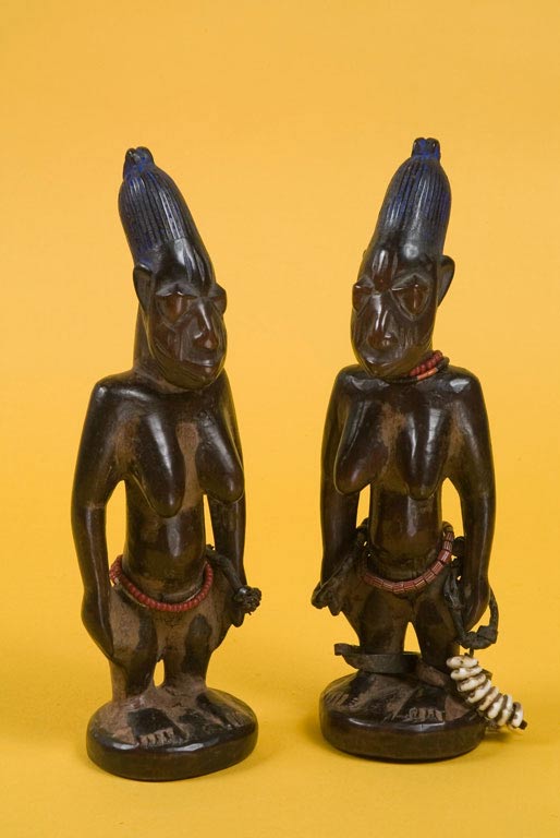A pair of female Ere Ibeji twin figures.