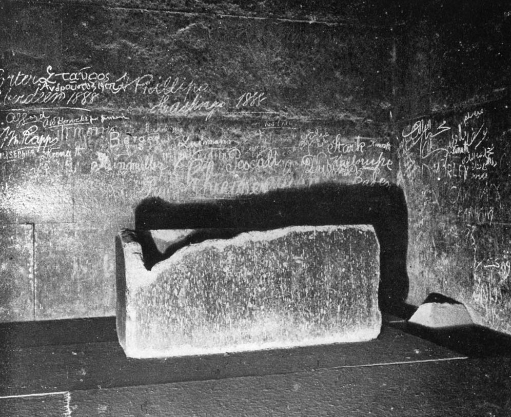 The sarcophagus in the King’s Chamber. Graffiti from the 1800’s cover the walls in this photo