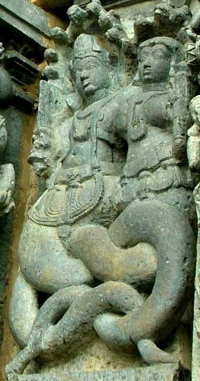 A sculpture of a naga couple in Halebidu, India.